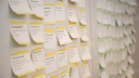 A photo of stickies with Tidy Dev Day issues on a wall