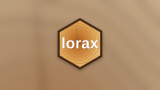 The lorax hex logo, a hexagonal cross-section of a tree trunk showing growth rings with the word lorax in white letters.